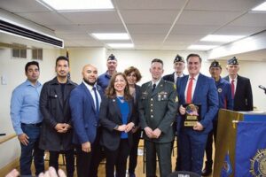 Post Commander Feuer and some Legionnaires pose for a picture with the local elected officials in attendance. Brian Romero who is running for Assemblywoman Jessica Gonzalez-Rojas’s seat is also in the picture. NYS Senator Gianaris holding the Legislative Award he received during the ceremony.