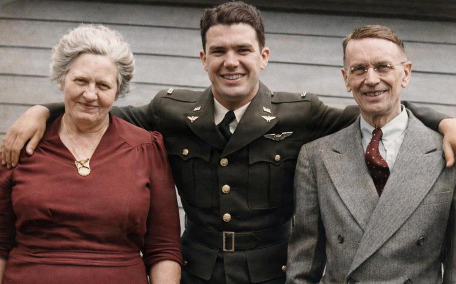 Joseph Burke and his parents Kathryn and William smile for a photo.