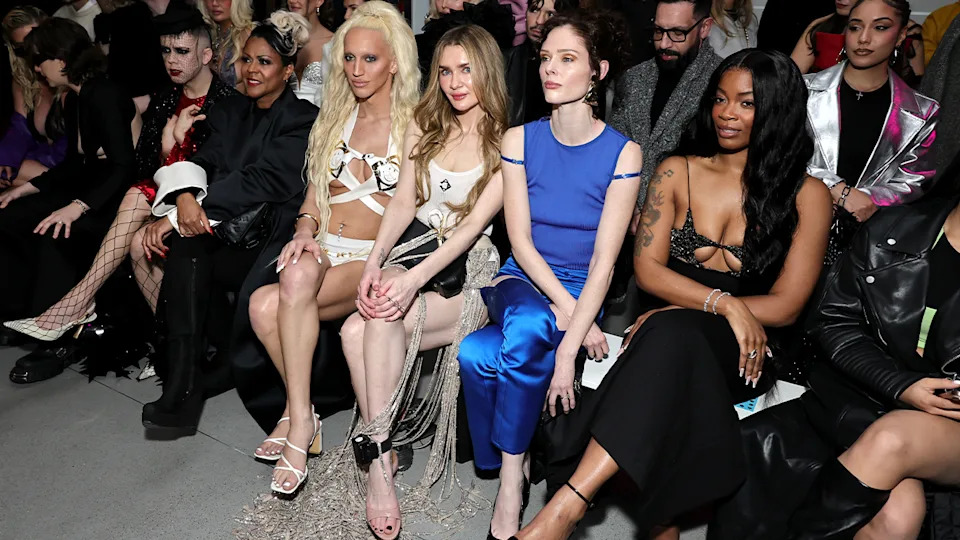 Anna Delvey Sorokin wearing an ankle monitor in the front row of a show during 2025 New York Fashion Week