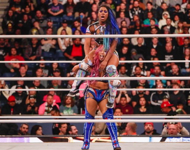 Mina Shirakawa carries ROH Women's World Champion Athena in the ring and under the roof of Louis Armstrong Stadium in Flushing NY on May 24, 2026 during a live televised broadcast of AEW Pay Per View Double or Nothing. (Photo by Andrew Schwartz)