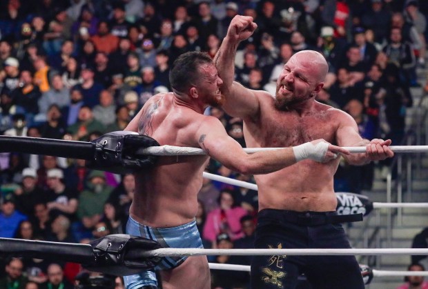 Jon Moxley delivers a punch to Kyle O'Reilly in the ring and under the roof of Louis Armstrong Stadium in Flushing NY on May 24, 2026 during a live televised broadcast of AEW Pay Per View Double or Nothing. (Photo by Andrew Schwartz)