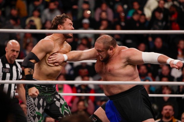 Samoa Joe delivers a chop to the chest of Will Ospreay in the ring and under the roof of Louis Armstrong Stadium in Flushing NY on May 24, 2026 during a live televised broadcast of AEW Pay Per View Double or Nothing. (Photo by Andrew Schwartz)