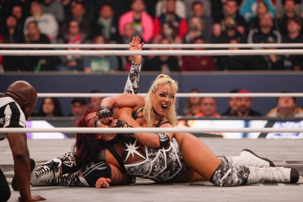 "The Toxic Spider" Thekla holds Kris Statlander on the mat by her jaw in the ring and under the roof of Louis Armstrong Stadium in Flushing NY on May 24, 2026 during a live televised broadcast of AEW Pay Per View Double or Nothing. (Photo by Andrew Schwartz)