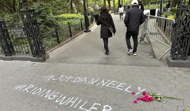 People walk past police barriers as they enter Washington Square Park on Friday, May 5, 2023, in New York. (AP Photo/Brooke Lansdale, File)