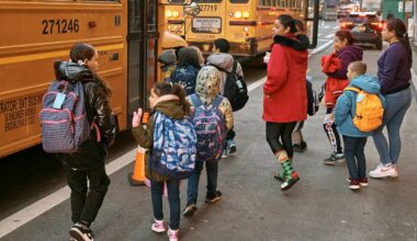 Students take the school buses on Tuesday, Dec. 12, 2023, in New York. (AP Photo/Andres Kudacki)