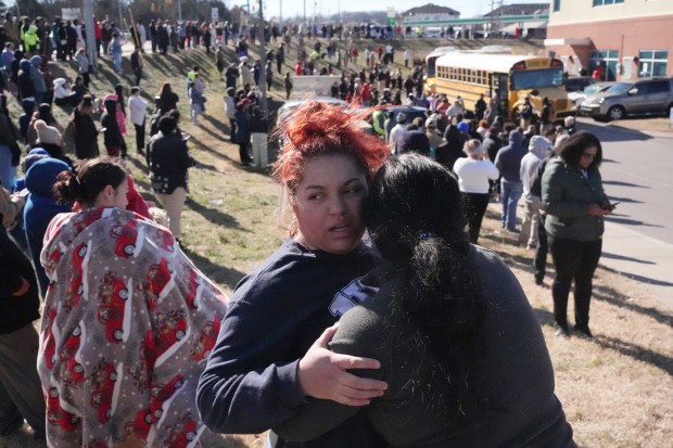 Families wait for loved ones after a school shooting at the Antioch High School in Nashville, Tenn., on Jan. 22, 2025.