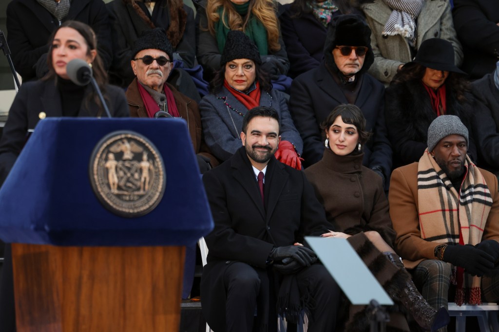 Mayor Zohran Mamdani, Rama Duwaji and New York Public Advocate Jumaane Williams along with Mamdani's parents Mahmood Mamdani and Mira Nair listen as Rep. Alexandria Ocasio-Cortez, D-N.Y. speaks during Mamdani's public swearing-in ceremony, Thursday, Jan. 1, 2026, in New York. (AP Photo/Heather Khalifa)