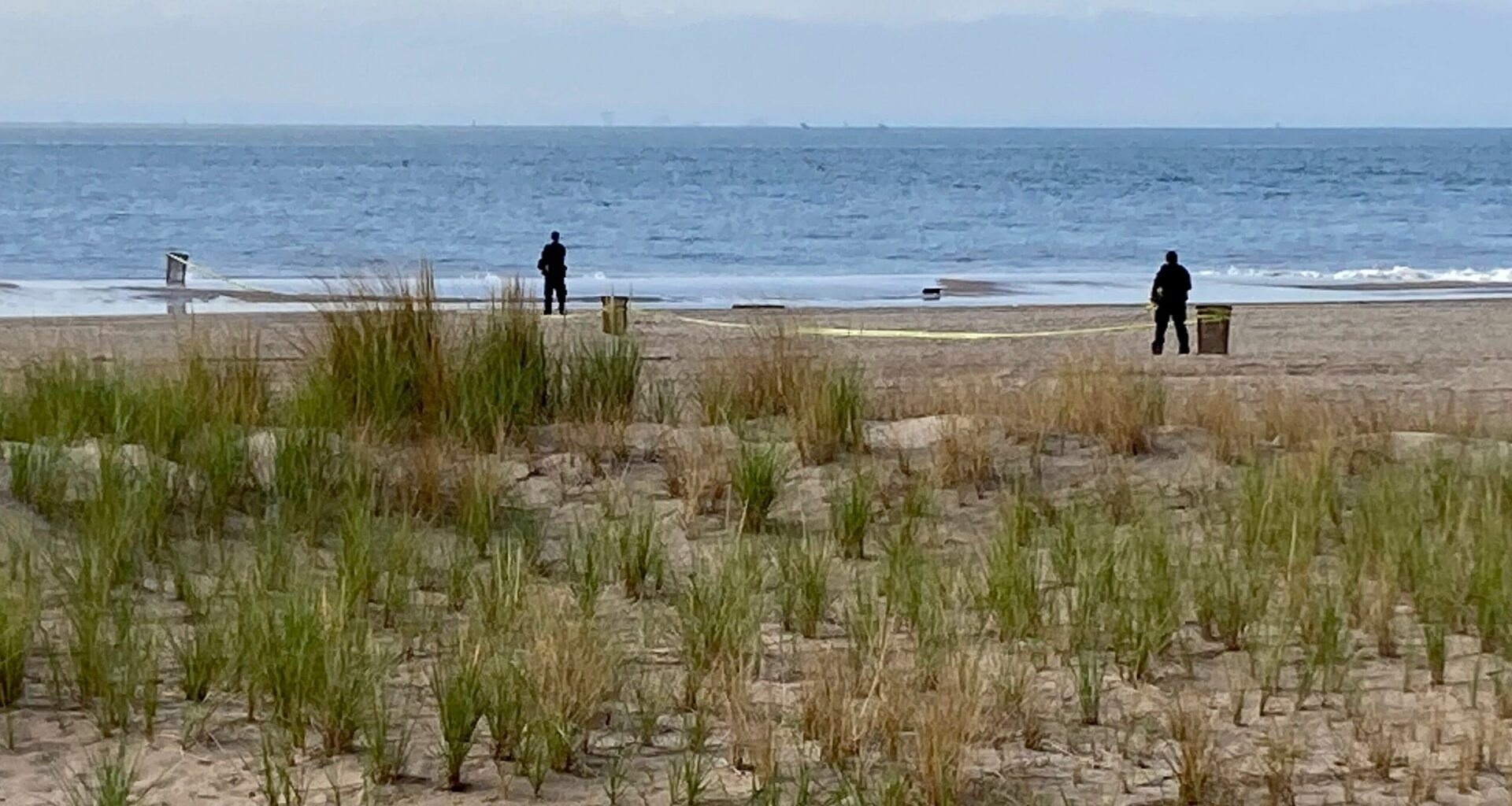 New York Police investigators examine a stretch of beach at Coney Island where three children were found dead in the surf, Sept. 12, 2022, in New York. Photo: Joseph Frederick/AP, File