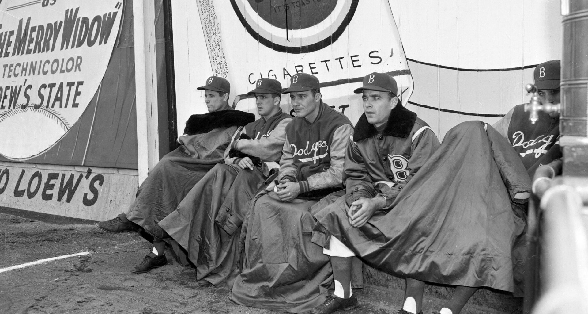 Members of the Brooklyn Dodgers watch the seventh and final game of the World Series against the New York Yankees from the bull pen at Ebbets Field in Brooklyn, New York, Oct. 7, 1952. From left to right are: Preacher Roe; Carl Erskine; Rube Walker and George Pfister. Player at extreme right is unidentified. The Yankees defeated the Dodgers, 4-2, winning the series 4 games to 3. Photo: Dick Strobel/AP