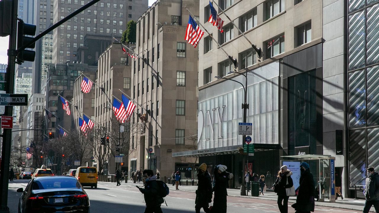 American flags wave in the wind on Fifth Avenue in the borough of Manhattan in New York City on Friday, Jan. 21, 2022.