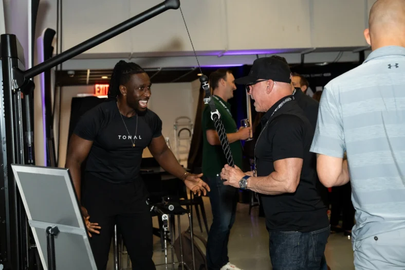 man tries the Tonal 2 machine at the ATN Innovation Summit