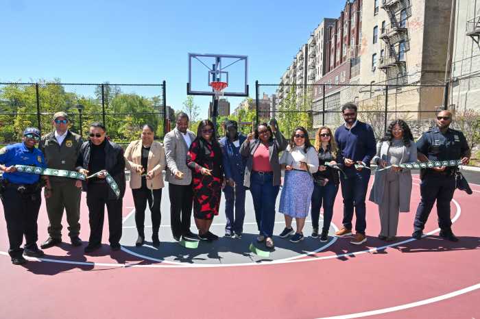 Community members and elected officials cut the ribbon, celebrating the expansion of Grant Park.