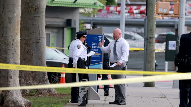 NYPD 69th Precinct and ESU officers investigate and collect evidence on the corner of Flatlands and Louisiana Avenues after an MTA bus driver was shot at and grazed by a bullet on his arm at the bus stop at the above location.