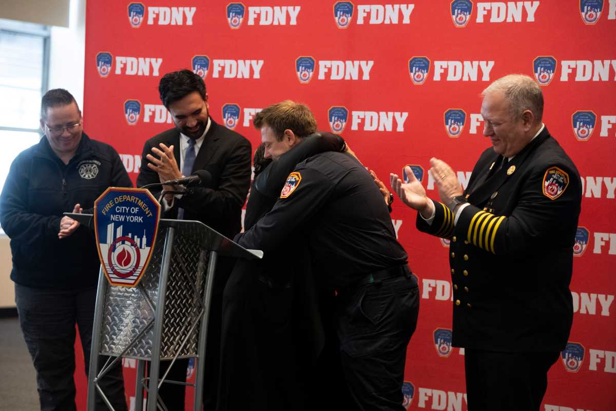 PS 81 Principal Carmen Pinto recalls being trapped in a flooded car with seconds to spare and Firefigher Travis Langan coming to her rescue with seconds to spare.