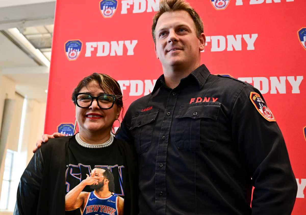 PS 81 Principal Carmen Pinto recalls being trapped in a flooded car with seconds to spare and Firefigher Travis Langan coming to her rescue with seconds to spare.