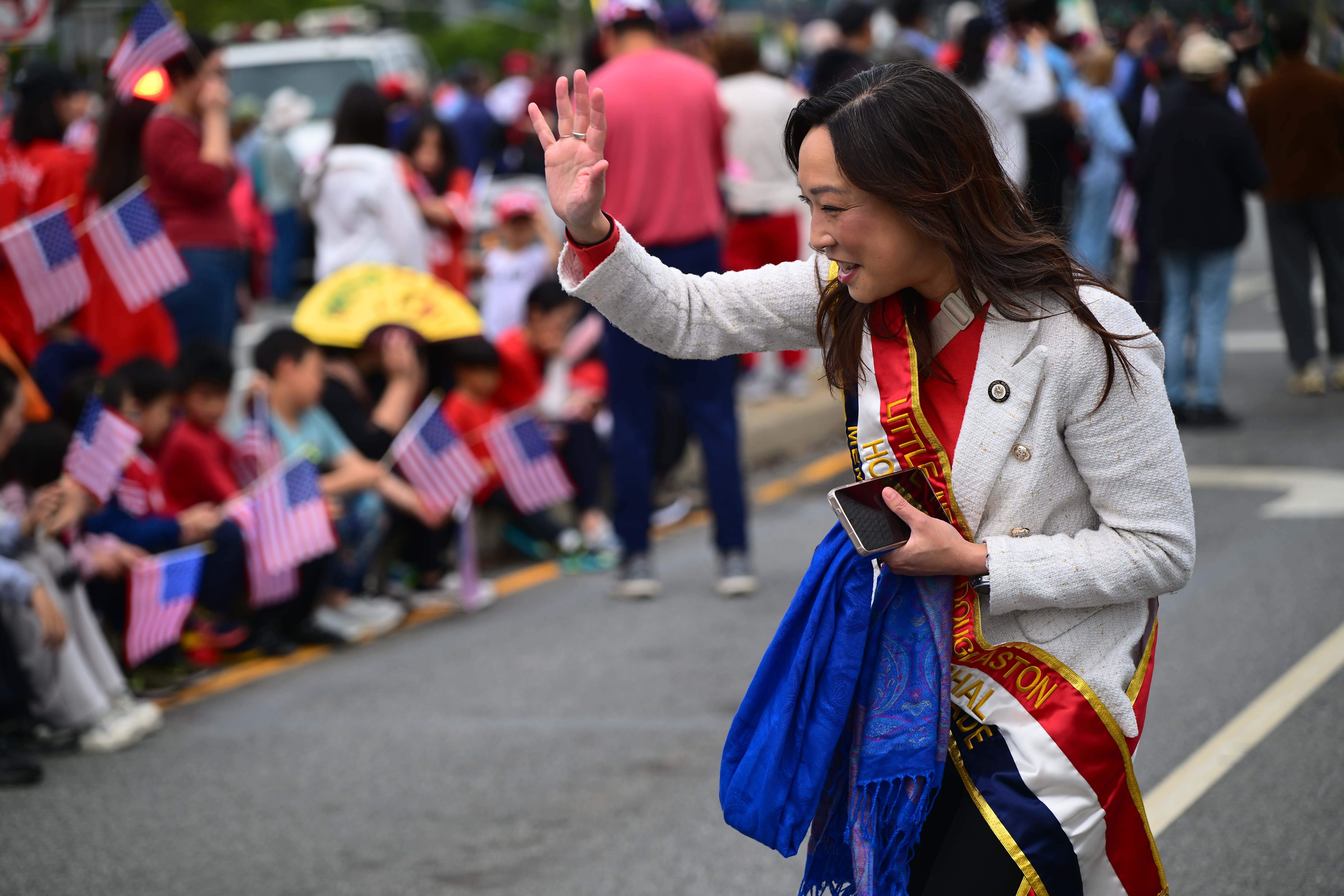 Council Member Linda Lee marches in the parade.