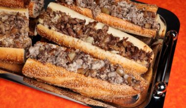 Cheesesteaks from Uncle Gus’ and John’s Roast Pork at the Inquirer studio on March 5, 2025. Food styling by Emilie Fosnocht.