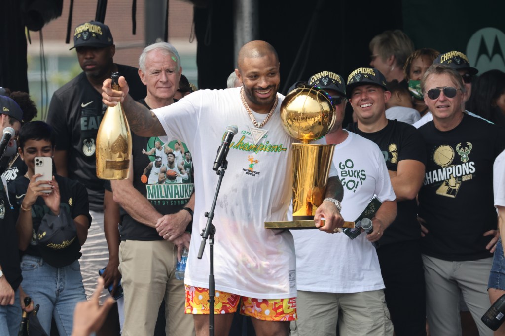  P.J. Tucker #17 of the Milwaukee Bucks celebrates with the Larry O'Brien Trophy during their Victory Parade & Rally of the 2021 NBA Finals on July 22, 2021 at the Fiserv Forum in Milwaukee, Wisconsin. 