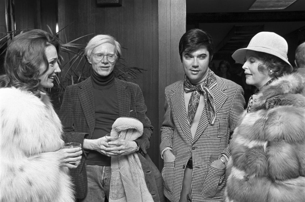 Lee Radziwill, Andy Warhol and Rex Reed attend the wrap party for the Elizabeth Taylor film "Ash Wednesday" in New York on November 6, 1973. 