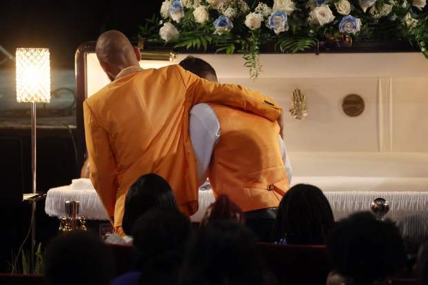 Friends, family, and mourners gather at the casket of O'Shae Sibley during funeral services and a celebration of life at the Met Philadelphia on Aug. 8, 2023 in Philadelphia. (Photo by Spencer Platt/Getty Images)