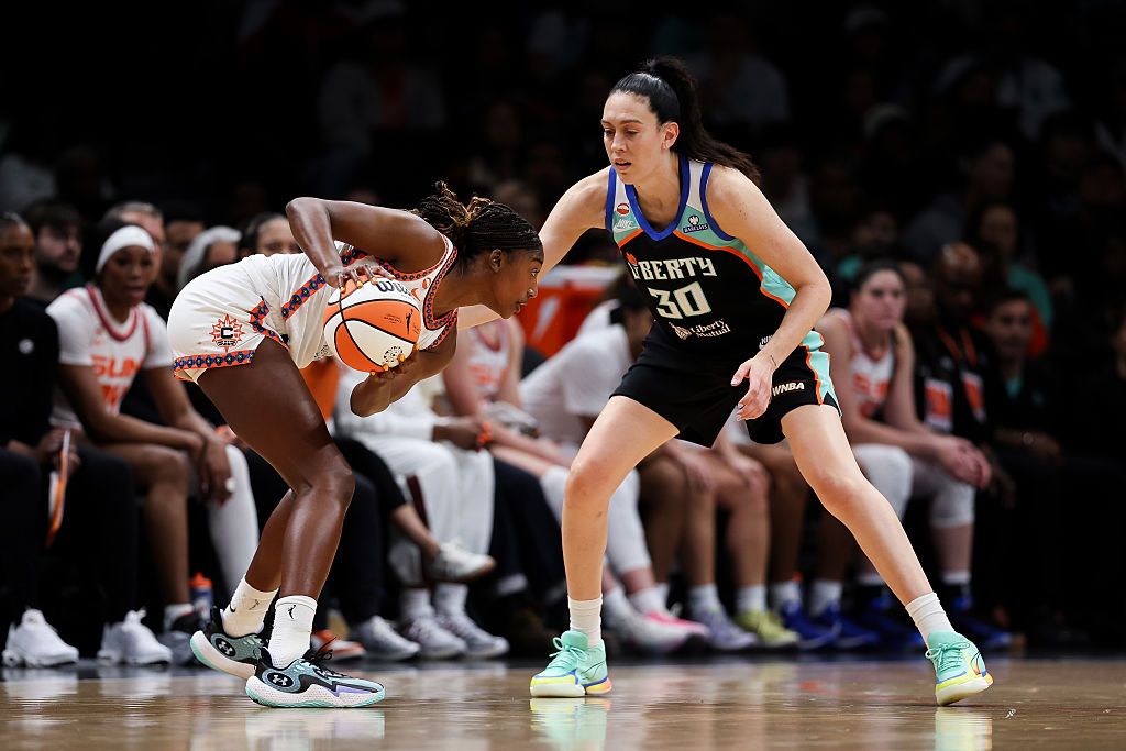 BROOKLYN, NEW YORK - MAY 08: Diamond Miller #1 of the Connecticut Sun drives against Breanna Stewart #30 of the New York Liberty during the second quarter of the season opener against the Connecticut Sun at Barclays Center on May 08, 2026 in the Brooklyn borough of New York City.