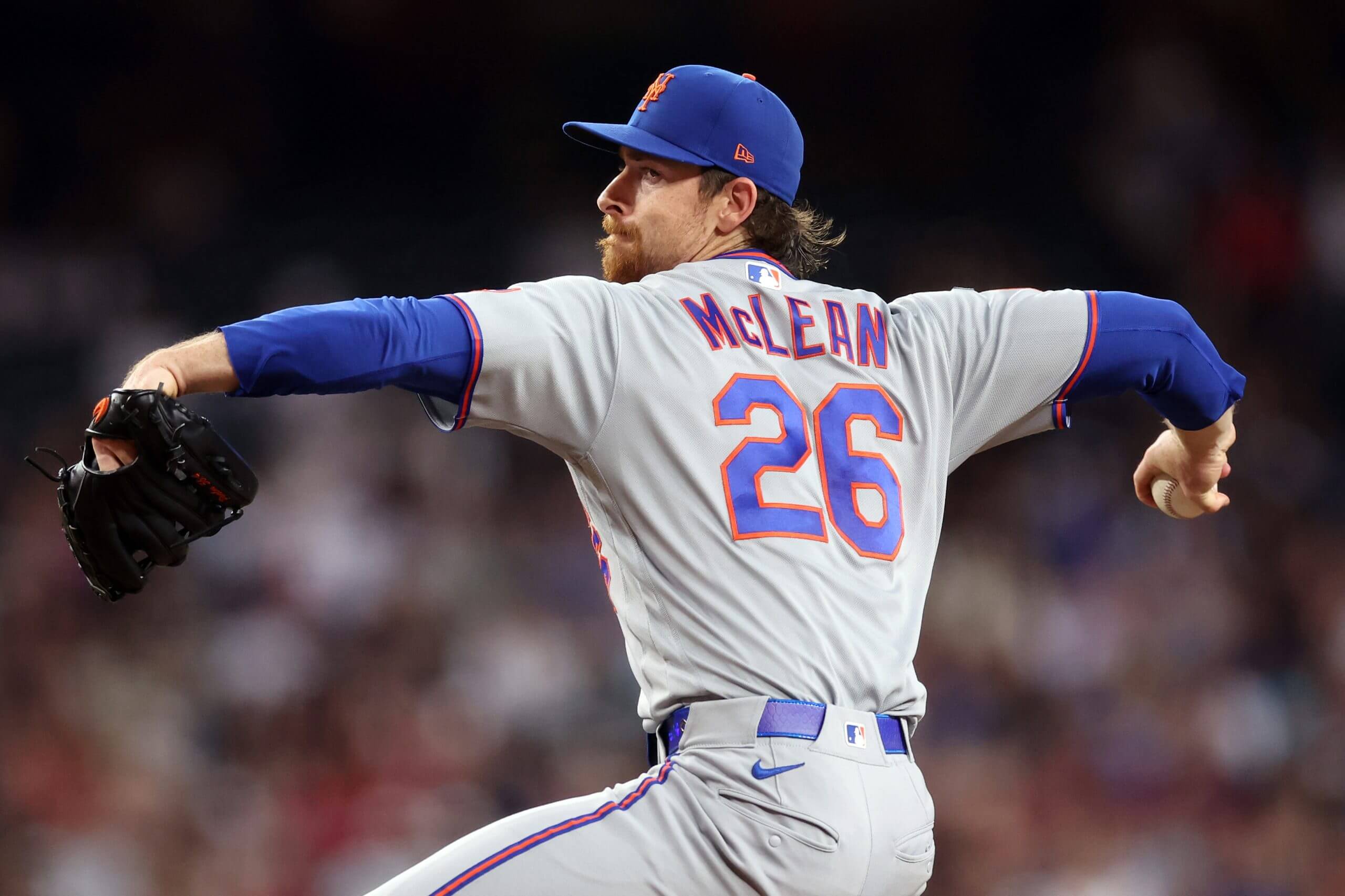 Nolan McLean reaches back as he prepares to deliver a pitch.