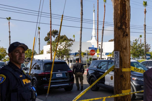 San Diego Police officers block the access to the Islamic Center of San Diego following a shooting in southern California, on May 18, 2026. (Photo by Zoë Meyers / AFP via Getty Images)