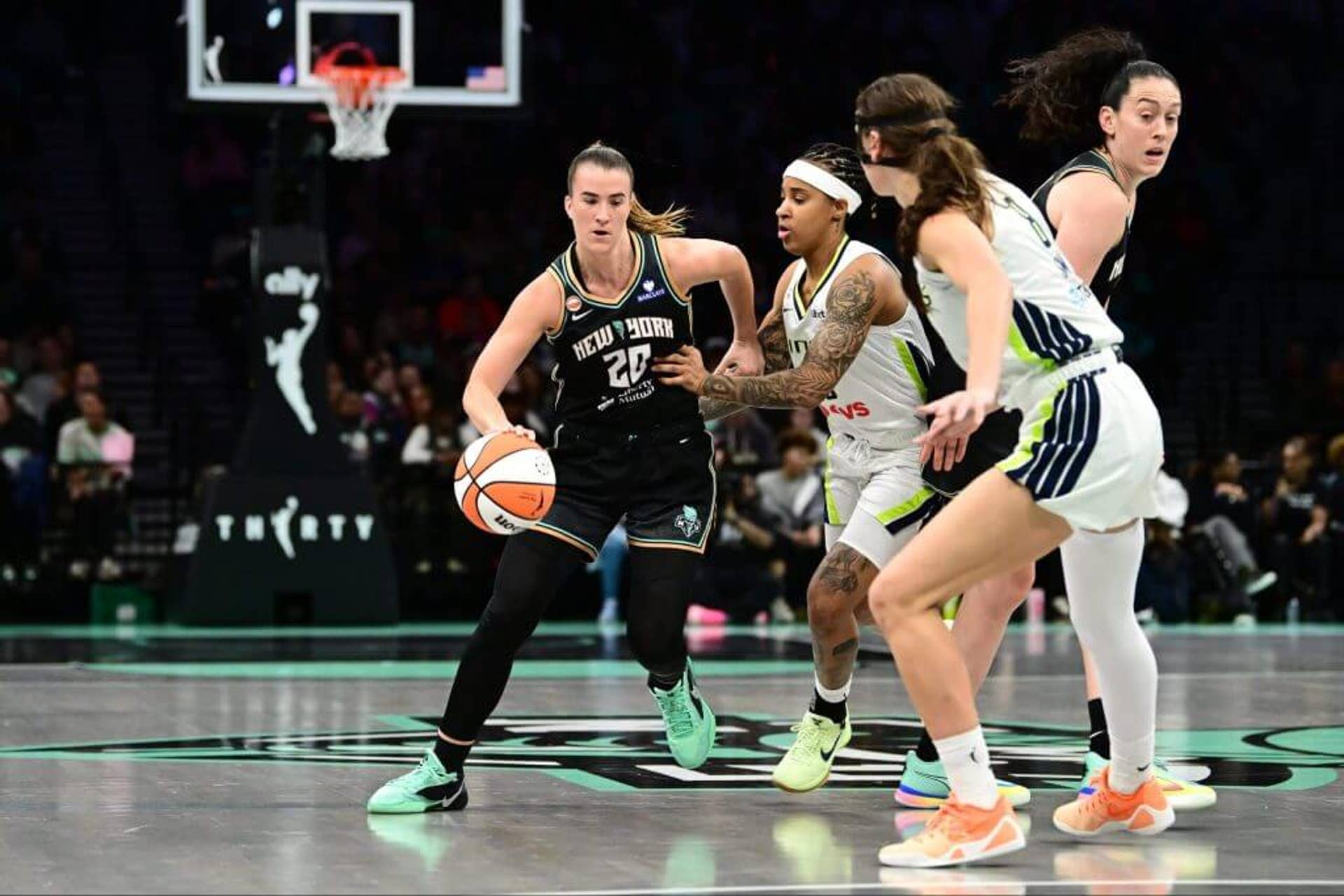 Sabrina Ionescu handles the ball for the Liberty against the Wings.