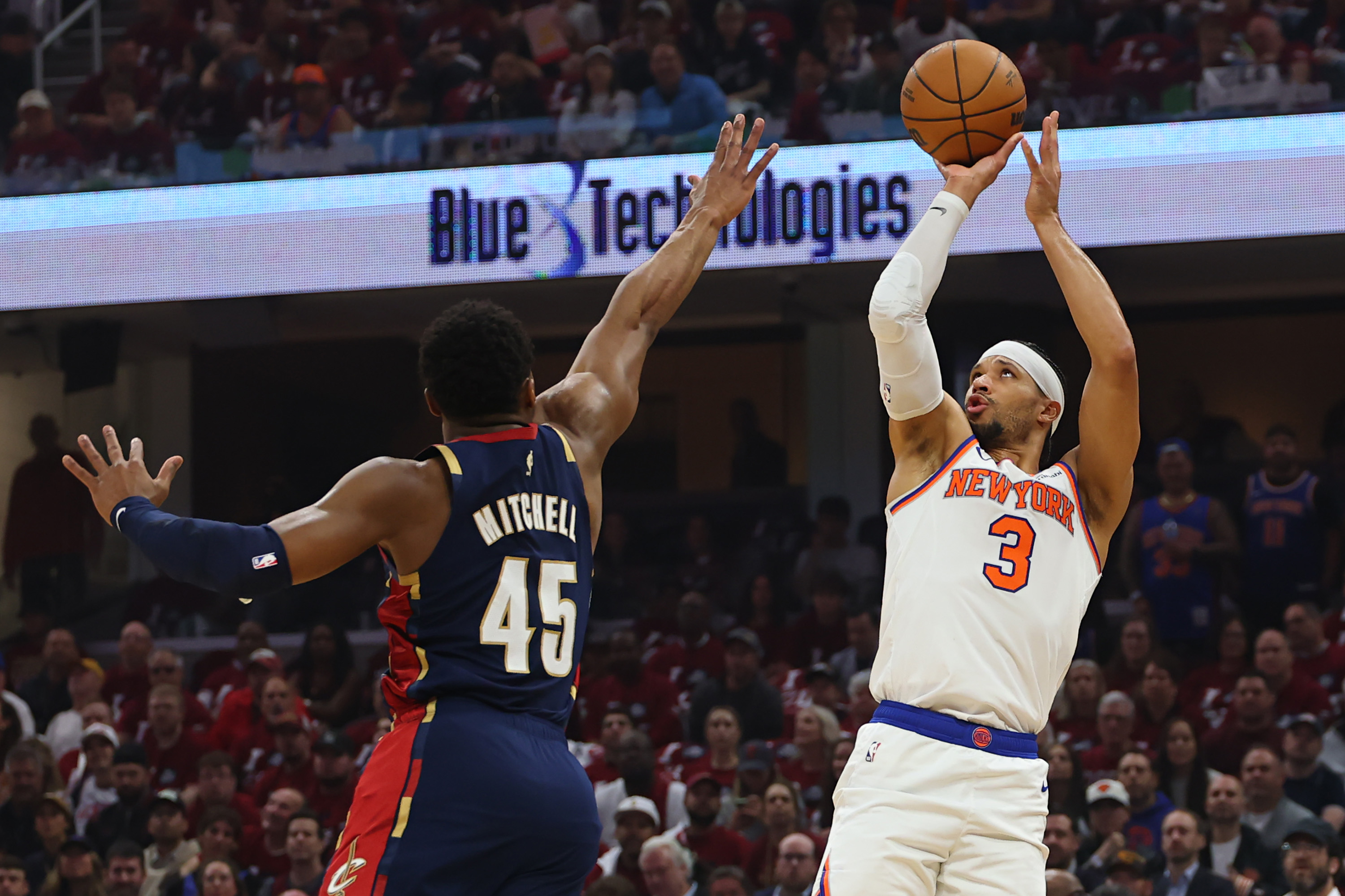Josh Hart #3 of the New York Knicks attempts a shot against Donovan Mitchell #45 of the Cleveland Cavaliers during the first quarter in Game Four of the NBA Eastern Conference Finals at Rocket Arena on May 25, 2026 in Cleveland, Ohio. (Photo by Gregory Shamus/Getty Images)