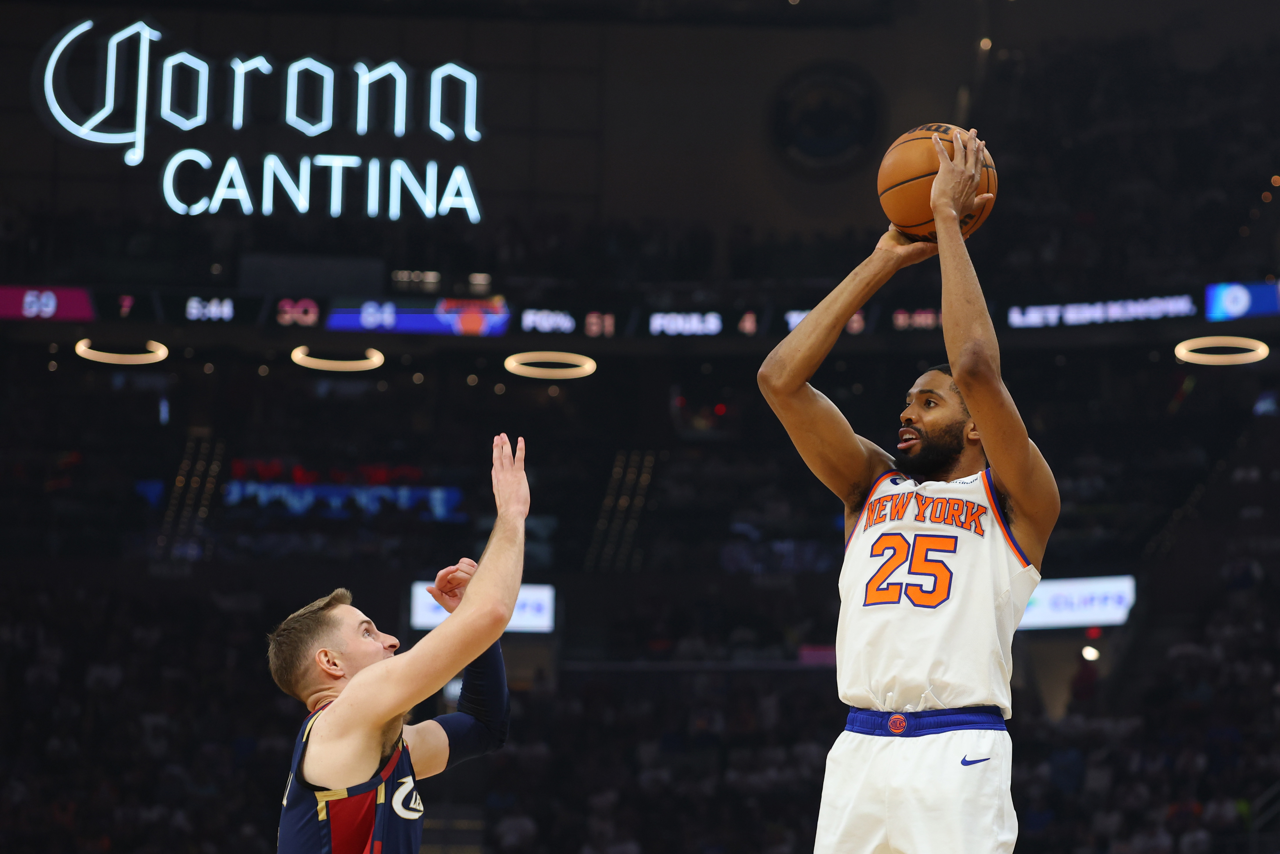 Mikal Bridges #25 of the New York Knicks attempts a shot against Dean Wade #32 of the Cleveland Cavaliers during the third quarter in Game Four of the NBA Eastern Conference Finals at Rocket Arena on May 25, 2026 in Cleveland, Ohio. (Photo by Gregory Shamus/Getty Images)