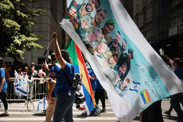 NEW YORK, NEW YORK - MAY 31: Thousands of Jewish and Israeli Americans participate in the annual Israeli Day Parade, the world's largest pro-Israel parade, on May 31, 2026, in New York City. This year's event takes place under heightened security with hundreds of police, K-9 units, and undercover officers patrolling the route up 5th Avenue. New York City mayor Zohran Mamdani did not attend the parade, the first mayor in recent history not to do so. (Photo by Spencer Platt/Getty Images)