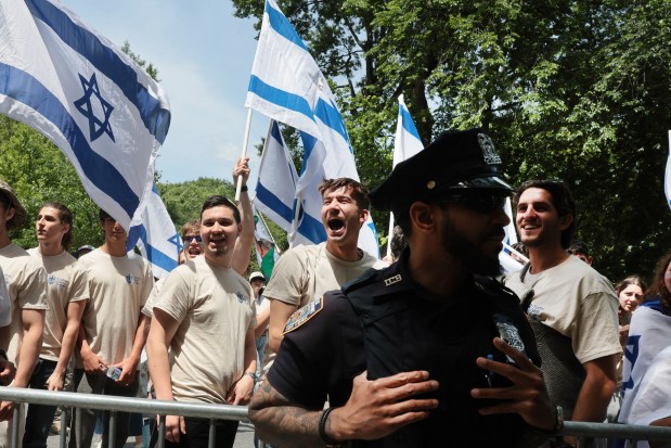 NEW YORK, NEW YORK - MAY 31: Thousands of Jewish and Israeli Americans participate in the annual Israeli Day Parade, the world's largest pro-Israel parade, on May 31, 2026, in New York City. This year's event takes place under heightened security with hundreds of police, K-9 units, and undercover officers patrolling the route up 5th Avenue. New York City mayor Zohran Mamdani did not attend the parade, the first mayor in recent history not to do so. (Photo by Spencer Platt/Getty Images)