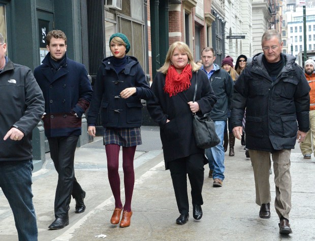 From left, Austin Swift, Taylor Swift, Andrea Finlay and Scott Swift are seen on Dec. 22, 2014, in New York City. (Photo by Gardiner Anderson/Bauer-Griffin/GC Images)