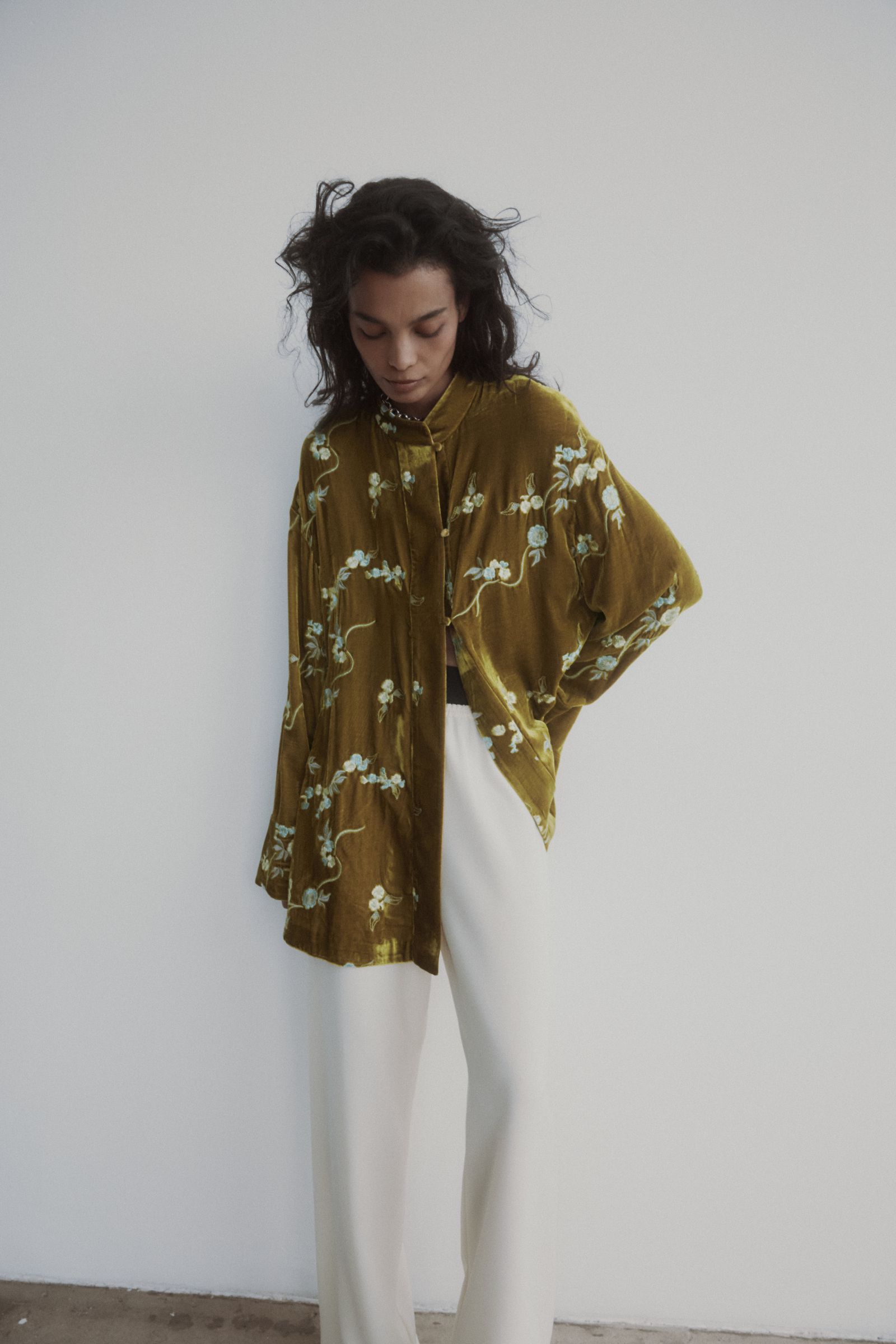 Image may contain Blouse Clothing Fashion Adult and Person