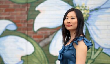 Clara Yang in front of a floral mural