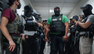four masked ice agents in foreground