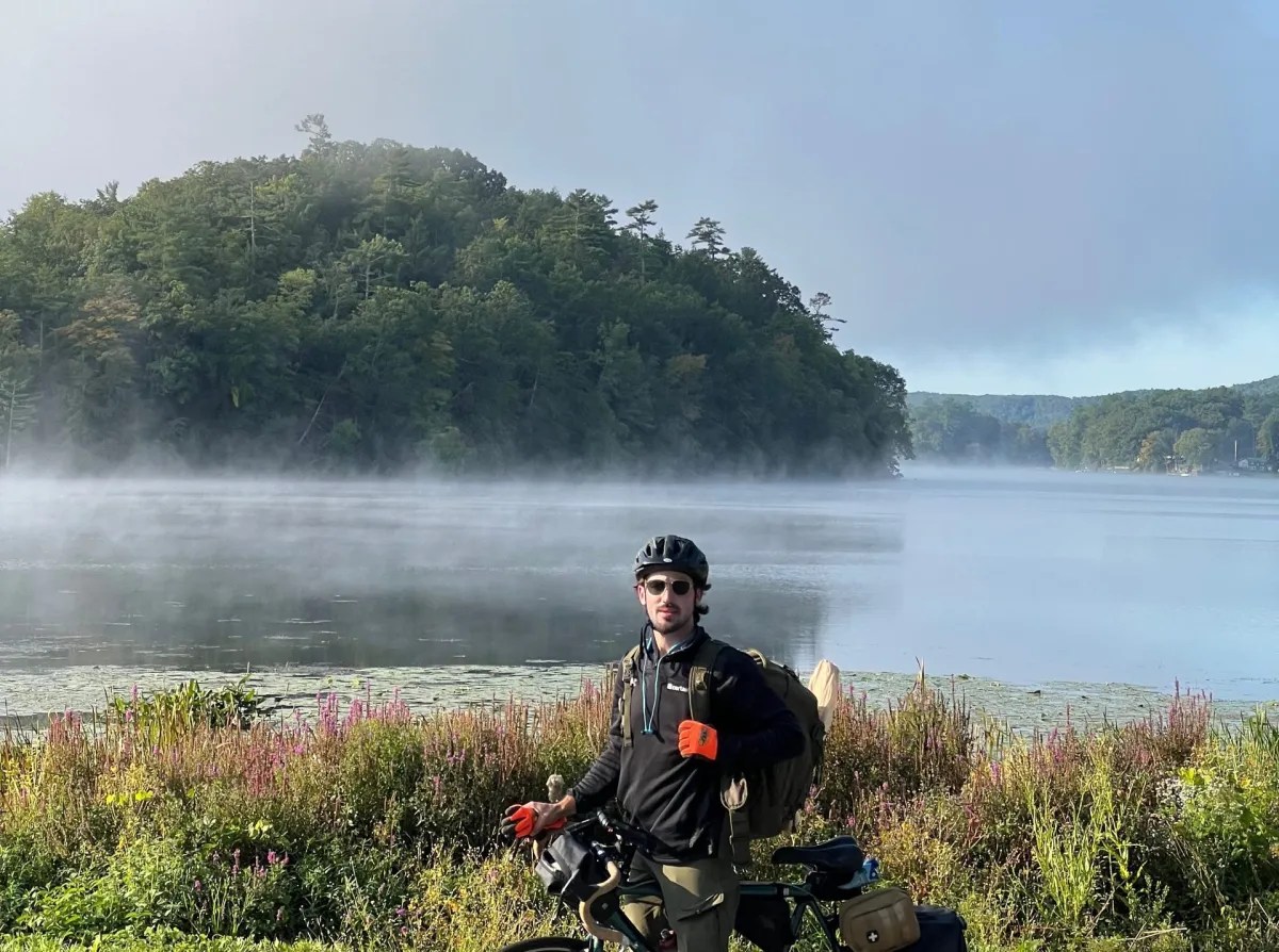 Biker beside lake