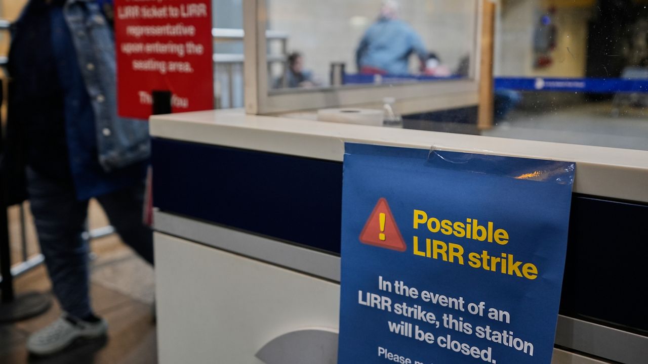 A sign warns commuters of a potential Long Island Rail Road strike at Penn Station in New York Thursday, May 14, 2026. (AP Photo/Seth Wenig)