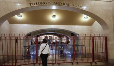 A passenger looks at a closed off entrance to the Long Island Rail Road at Grand Central station on Saturday, May 16, 2026, in New York. (AP Photo/Heather Khalifa)