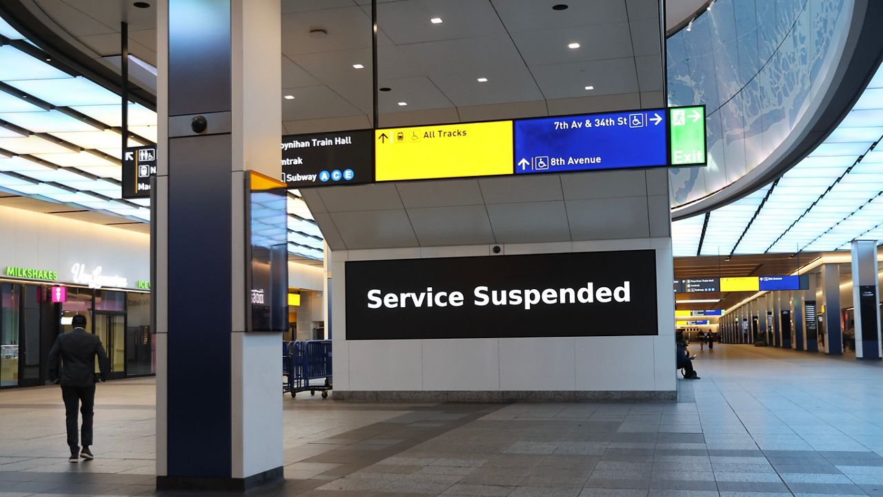 Service suspended signs are posted inside Penn Station on the first day of a Long Island Rail Road strike. (AP Photo/Heather Khalifa)
