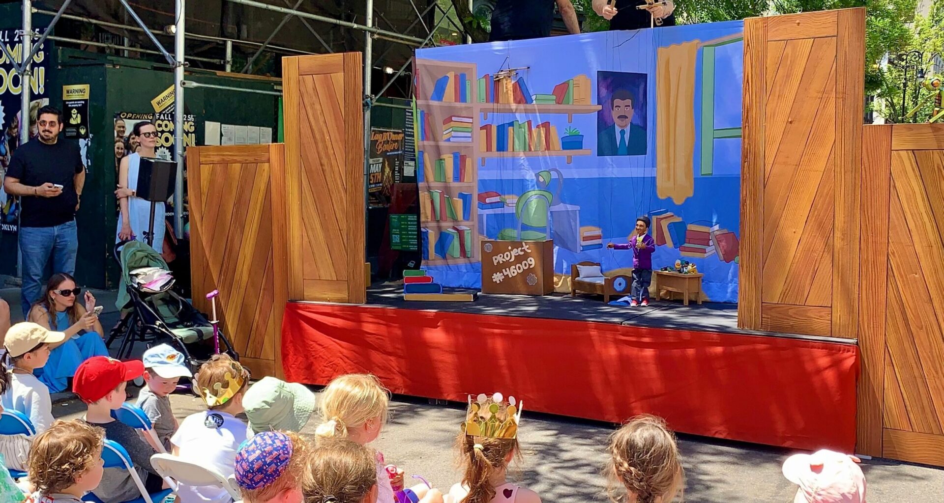 Kids watch entranced as puppeteers from the City Parks Foundation’s PuppetMobile put Pinocchio through his paces on Montague Street. Photo: Mary Frost/Brooklyn Eagle
