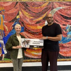 MTA Arts & Design Director Tina Vaz, left, with artist Christopher Myers, in front of one of his mosaics at the Church Avenue subway station. Photo: Mary Frost/Brooklyn Eagle