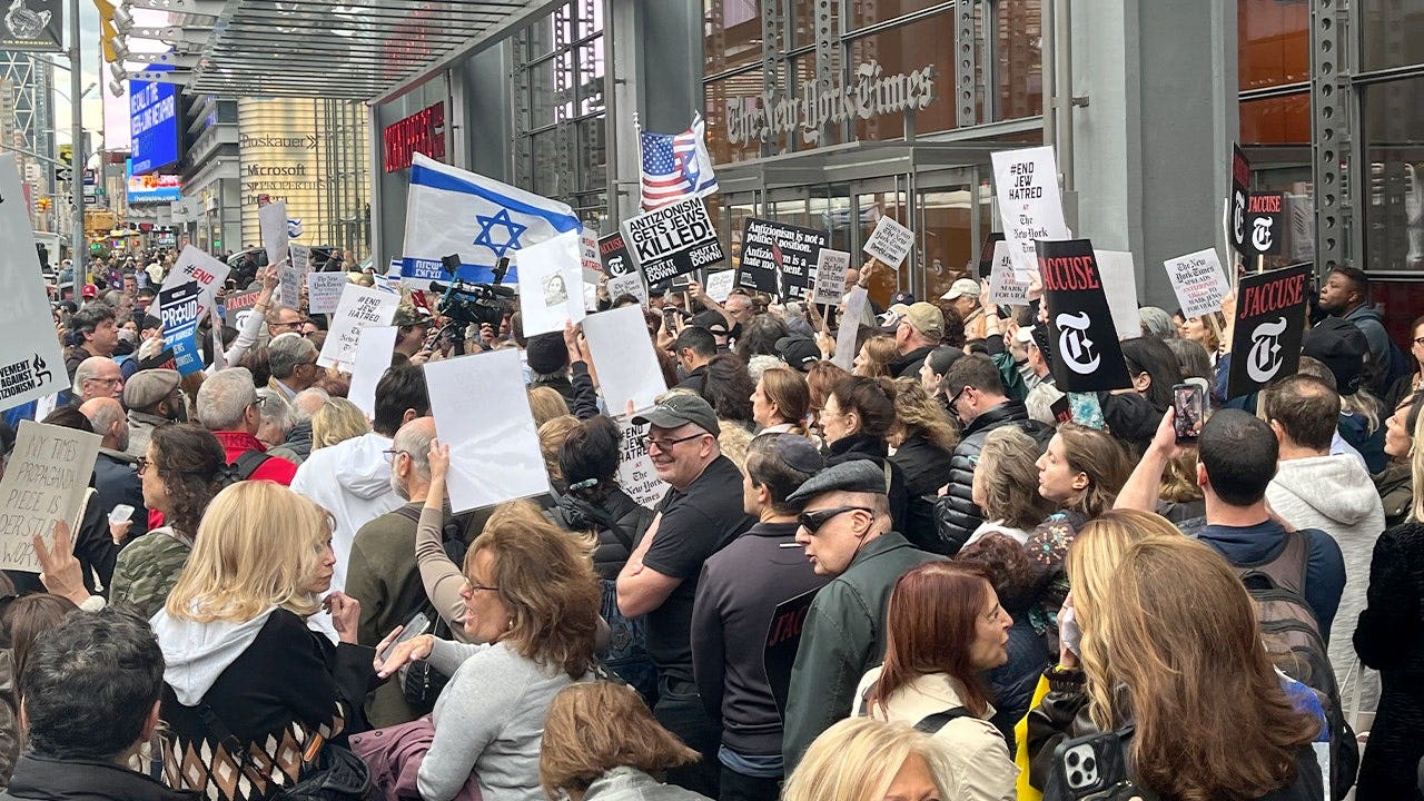 Protesters rally outside New York Times, demand Kristof firing over article