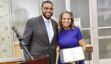 Dr. Demario Strickland presented Board of Education President Dr. Donna Marable with a certificate noting her achievement.