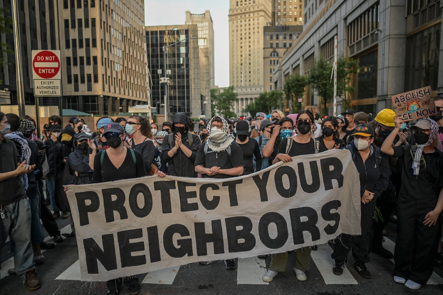 Protesters block an entrance to the Federal building on Broadway after a rally against ICE arrests at Foley Square in New York, on June 10, 2025.