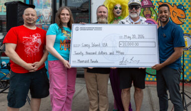 Brooklyn Borough President Antonio Reynoso presents a check to Coney Island USA to ensure the Mermaid parade. Photo: Brooklyn Borough President Antonio Reynoso’s office