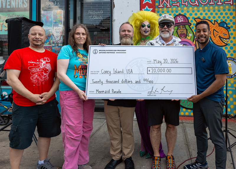 Brooklyn Borough President Antonio Reynoso presents a check to Coney Island USA to ensure the Mermaid parade. Photo: Brooklyn Borough President Antonio Reynoso’s office