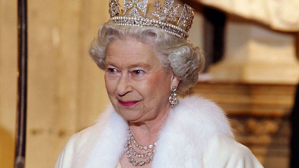Queen Elizabeth II smiling and wearing a crown