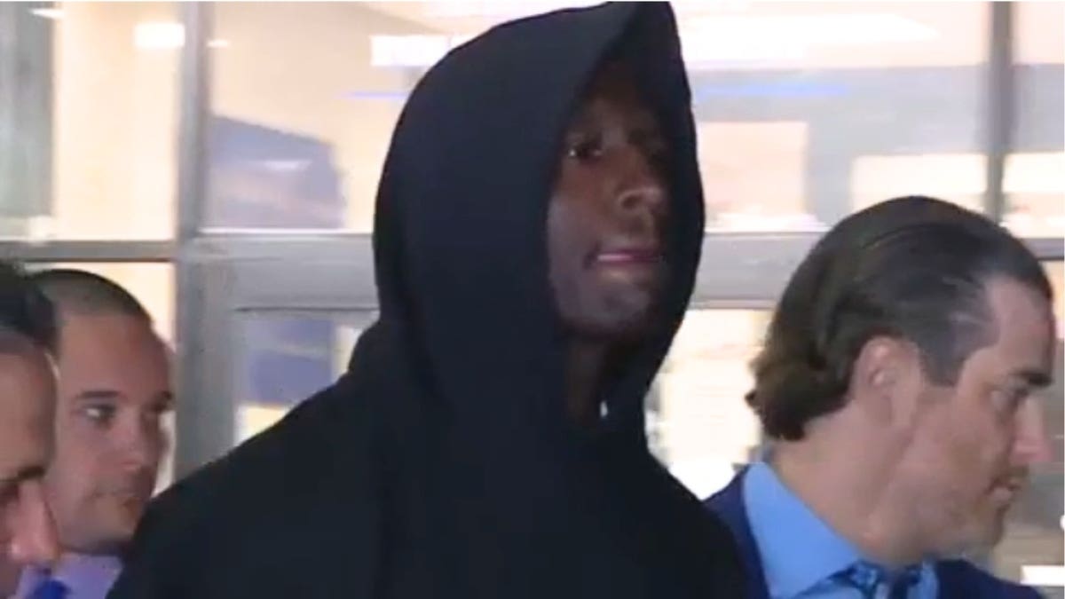 Rhamell Burke wears a black hoodie