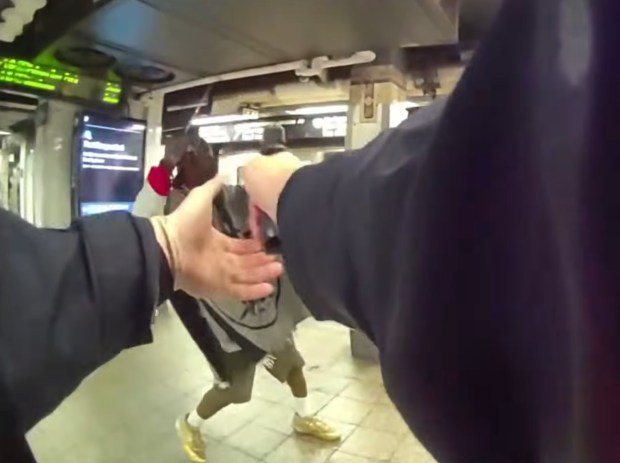 Anthony Griffin confronted NYPD Transit detectives Ryan Giuffre and Anthony Manetta while wielding a machete on the stairs leading from the mezzanine to the uptown 4/5/6 platform inside Grand Central Station around 9:40 a.m. on April 11, the newly released footage shows. (NYPD)